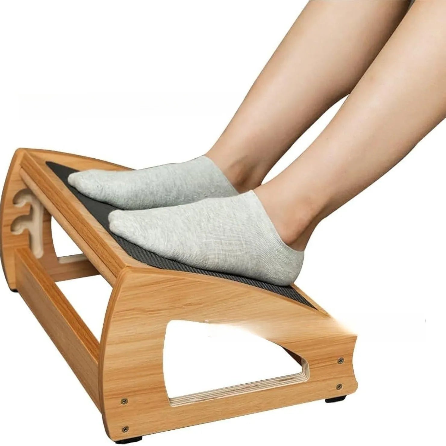 Adjustable bamboo office desk footstool in natural wood colour on a floor.