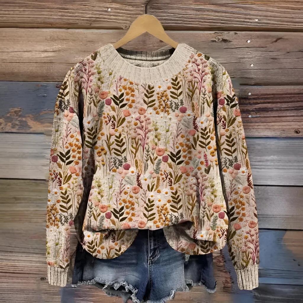 Women's round neck sweater with a digital floral print in a polyester fabric.