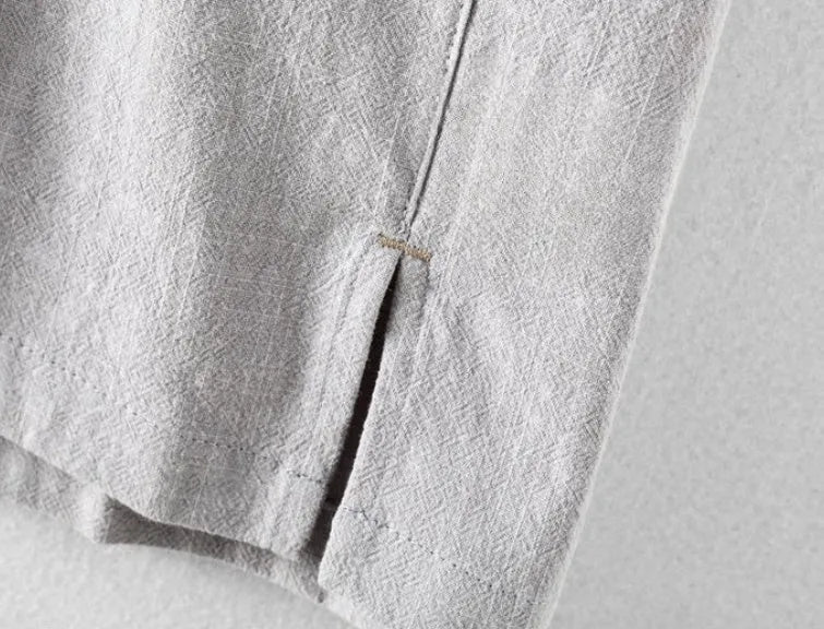 Man wearing a loose-fit light grey linen casual shirt for leisure.