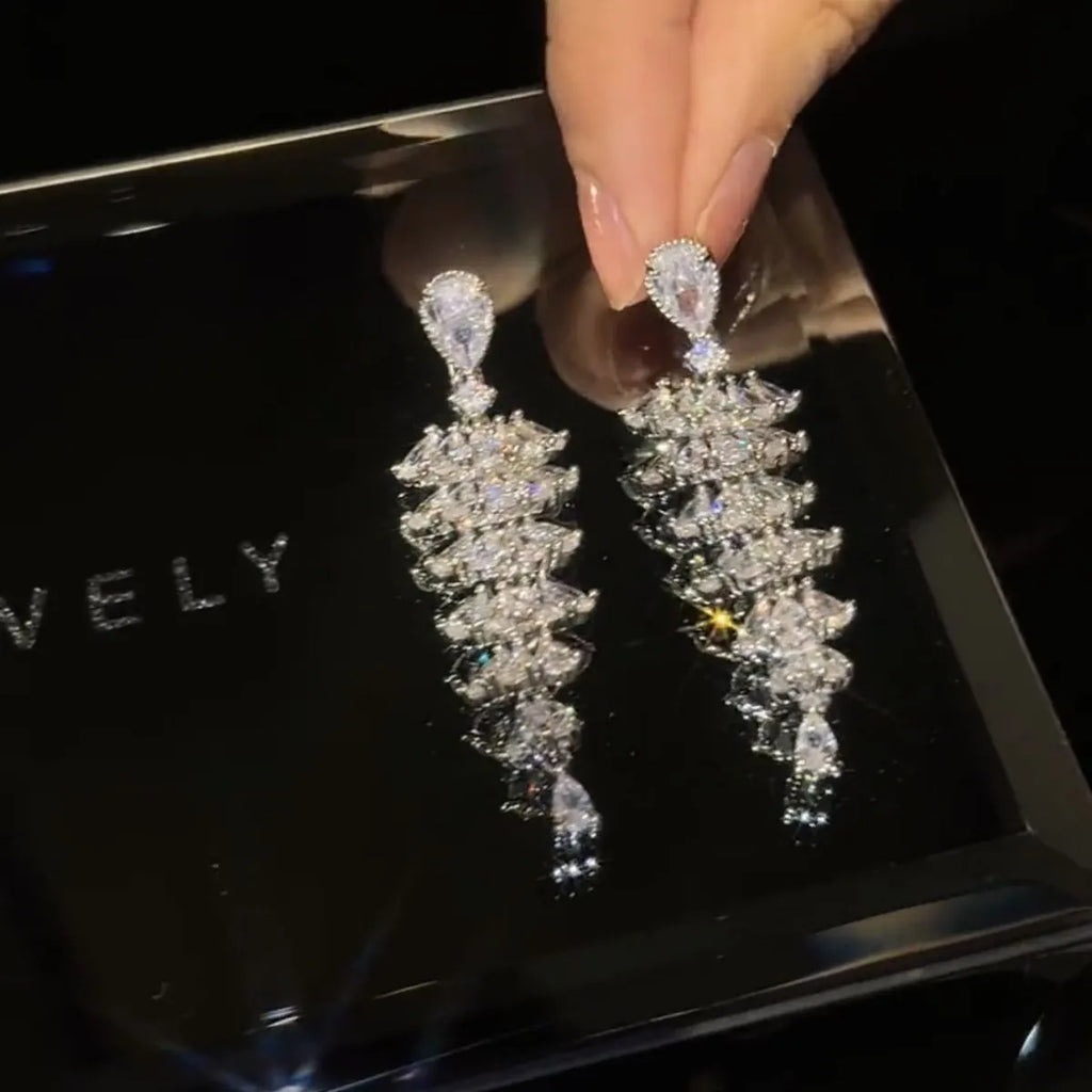 Silver pagoda Christmas tree drop earrings with sparkling zircon detail on copper studs.