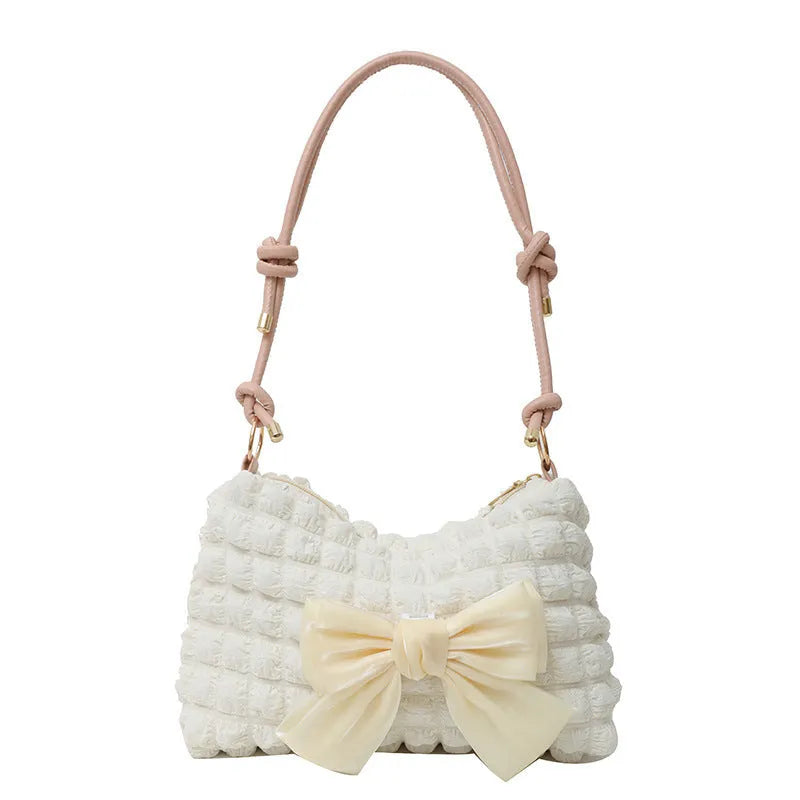 Women's canvas shoulder bag in horizontal square shape with adjustable strap and sandwich pocket