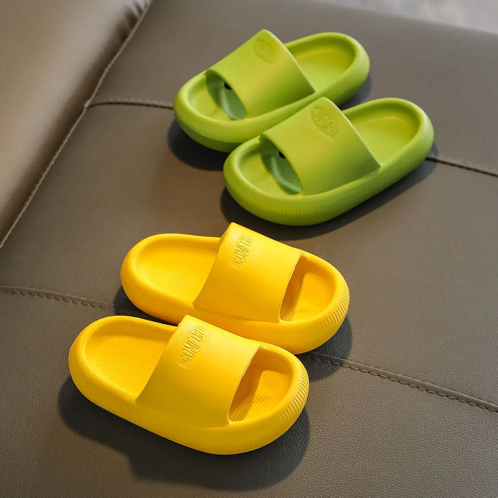 Children's EVA slippers in mixed colours with non-slip soles showing size range 24-35
