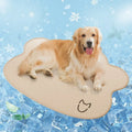 Dog cooling mat made of ice silk in a dog head shape, shown in light grey on a wooden floor.