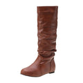Women's black slip-on ankle boots with flat heel and round toe design
