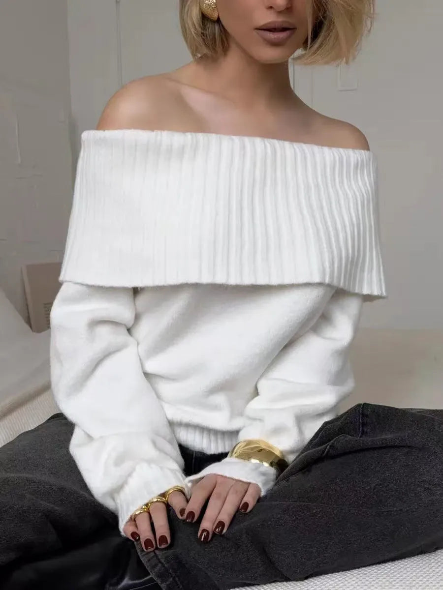 Grey off-the-shoulder strapless pullover sweater with a 3D pattern on a model.