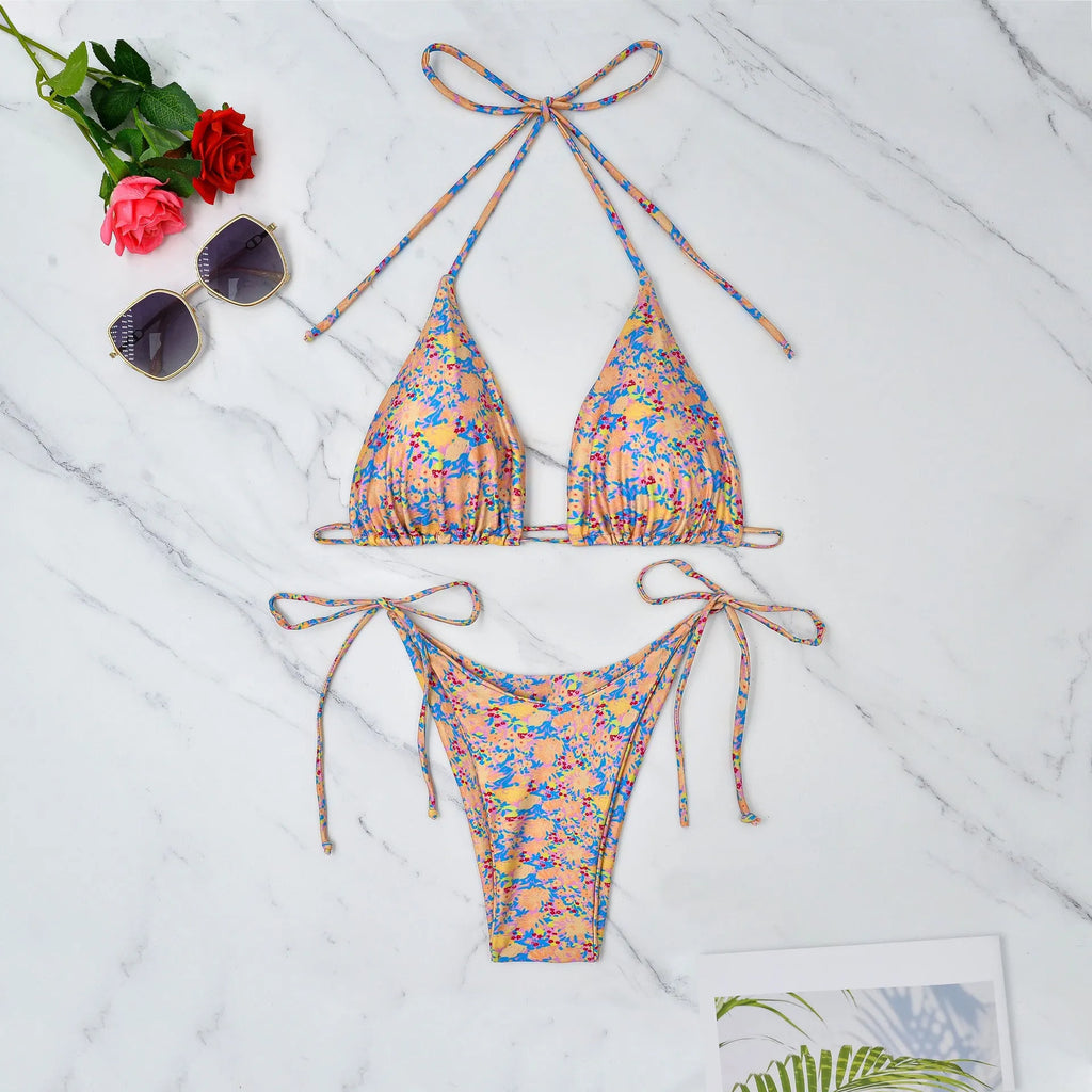 Women's lace-up bikini swimsuit with backless design and split briefs in polyester fabric