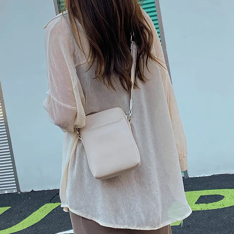 Solid colour small crossbody shoulder bag for women in beige, black, green, or khaki