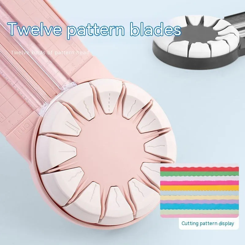 Pink 12-in-1 paper cutting machine with interchangeable blades for scrapbooking on white background