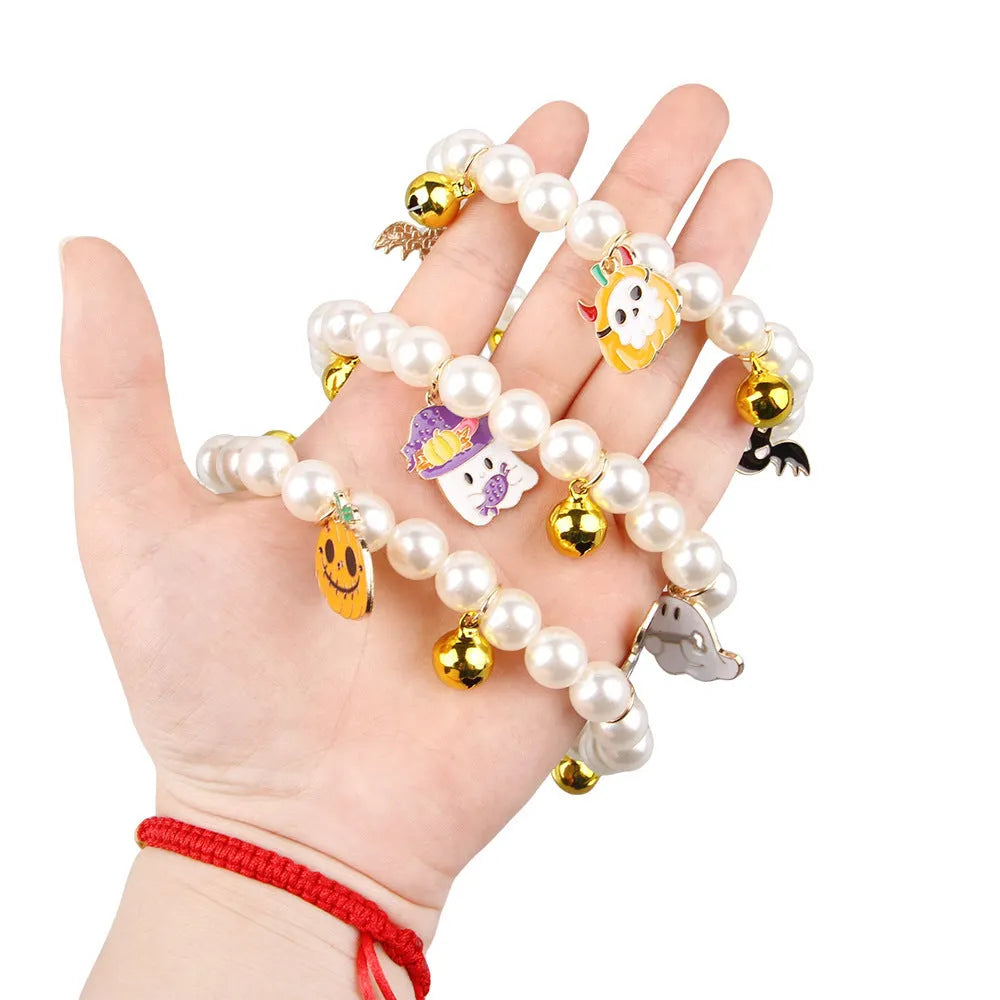 Halloween-themed cat collar with simulated pearl beading showing purple ghost pumpkin design.