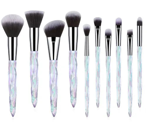 Ten clear crystal-handled foundation brushes with artificial fibre bristles in black, blue, red, and yellow colours