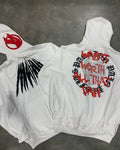 Black hooded sweatshirt with white printed skull design and rhinestone details, loose cardigan style