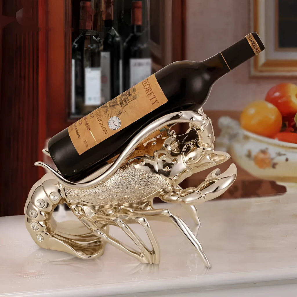 Lobster-shaped wine rack ornament in rose gold or silver resin finish on a table.
