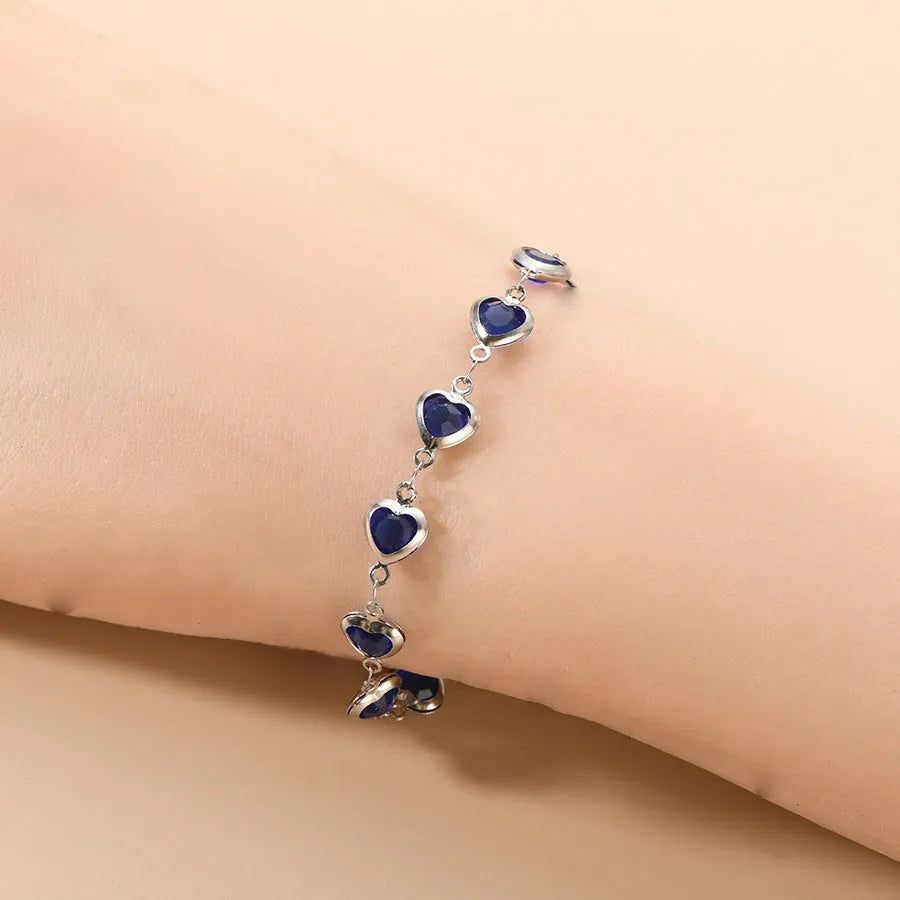 Devil's Eye Creative All-match Fashion Heart Bracelet in stainless steel on a wrist.