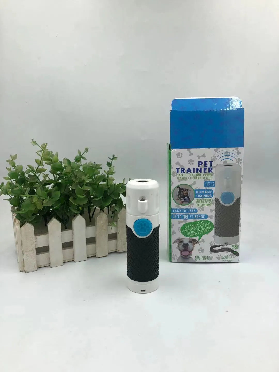 White handheld ultrasonic dog bark trainer with compact design
