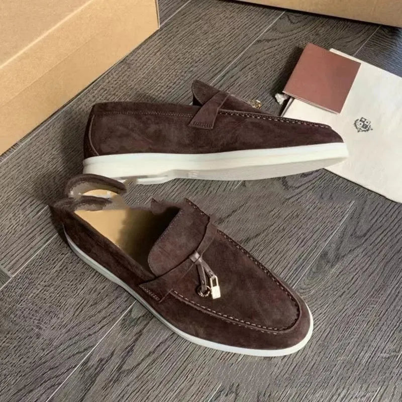 Casual slip-on Gommino loafers in black with round toe, rubber sole, and high-top design.
