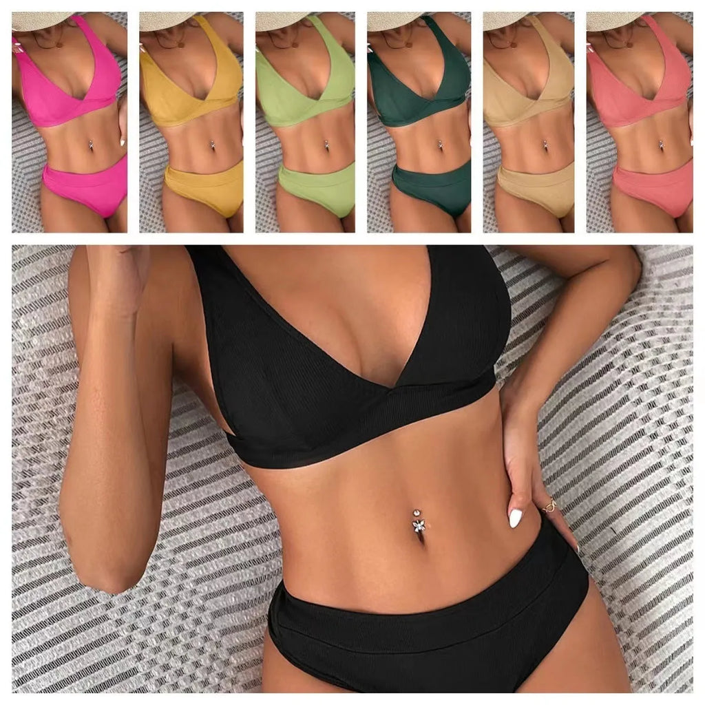 Women's black bikini with lace-up front detail and high-leg split style on a mannequin.