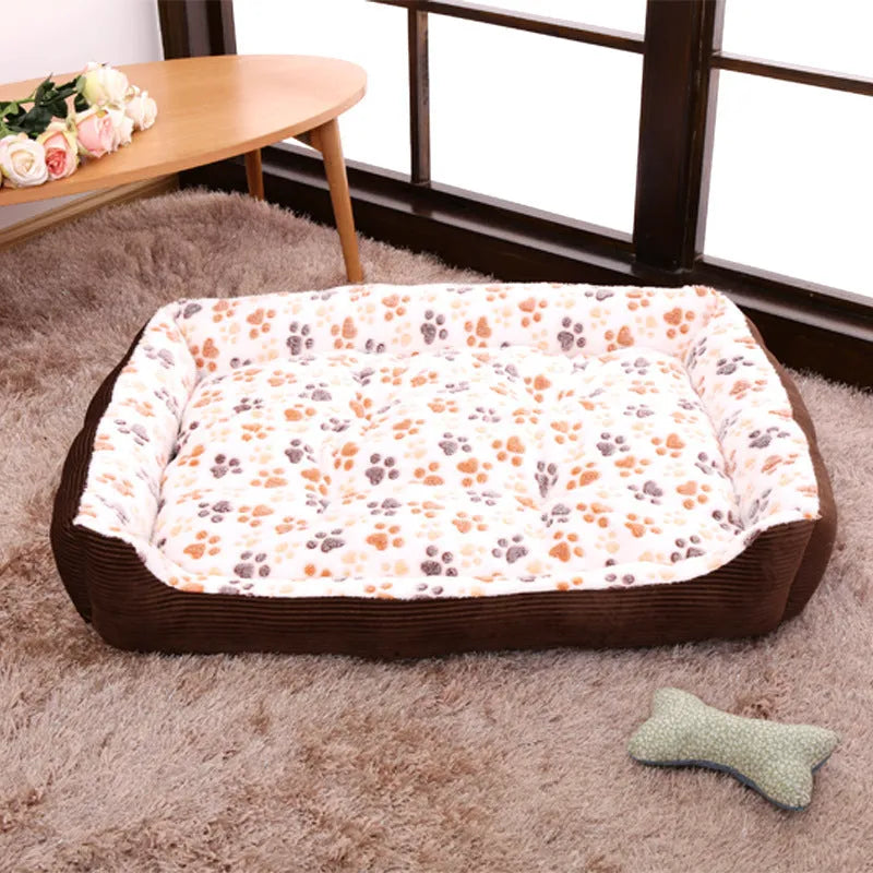 Beige plush bolster dog bed for small dogs on a wooden floor, showing non-slip bottom and raised sides.