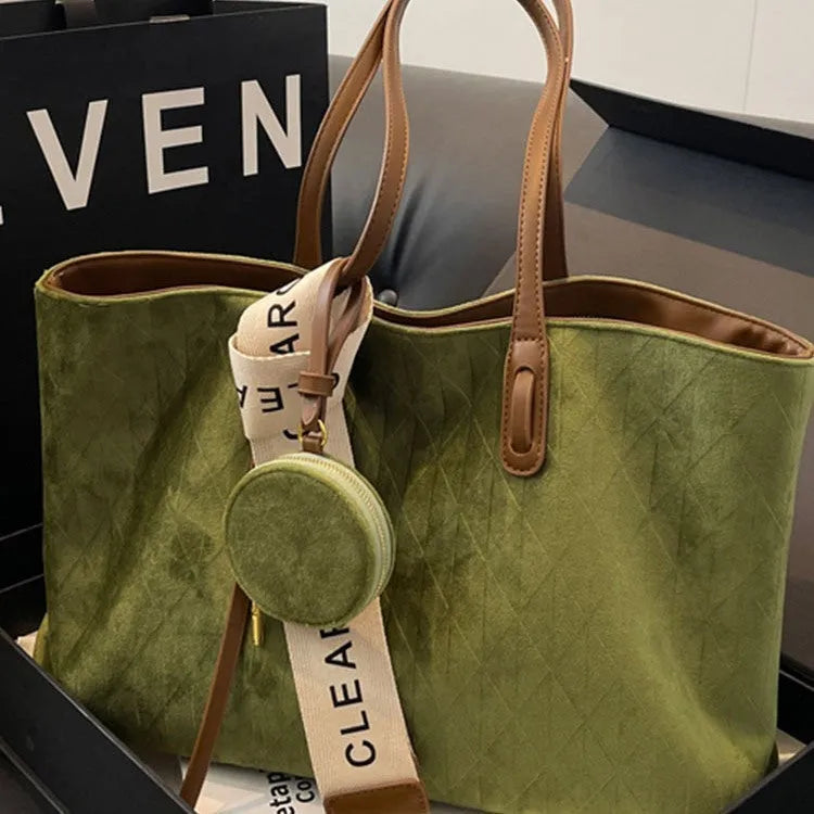 Large capacity polyester shoulder bag in green colour showing horizontal square shape and shoulder strap