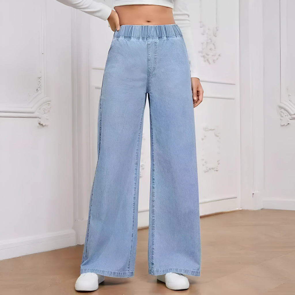 Women's light blue washed wide-leg jeans with straight cut trousers and mid-waist zip fly