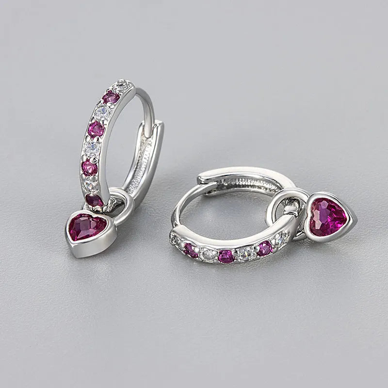 Women's heart-shaped drop earrings with colourful stones in gold or white gold coloured settings