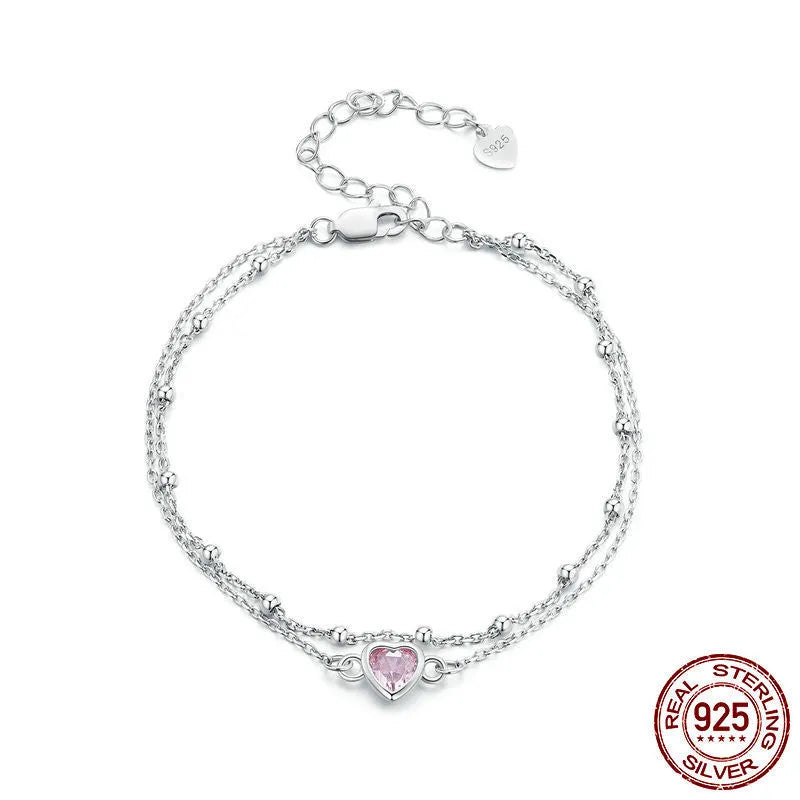 Women's sweet girlish style sterling silver bracelet with a small heart charm on an adjustable chain.