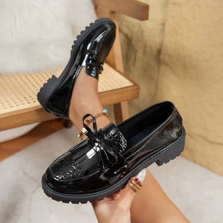 Women's brown loafers with bow detail and flat sole on artificial PU upper