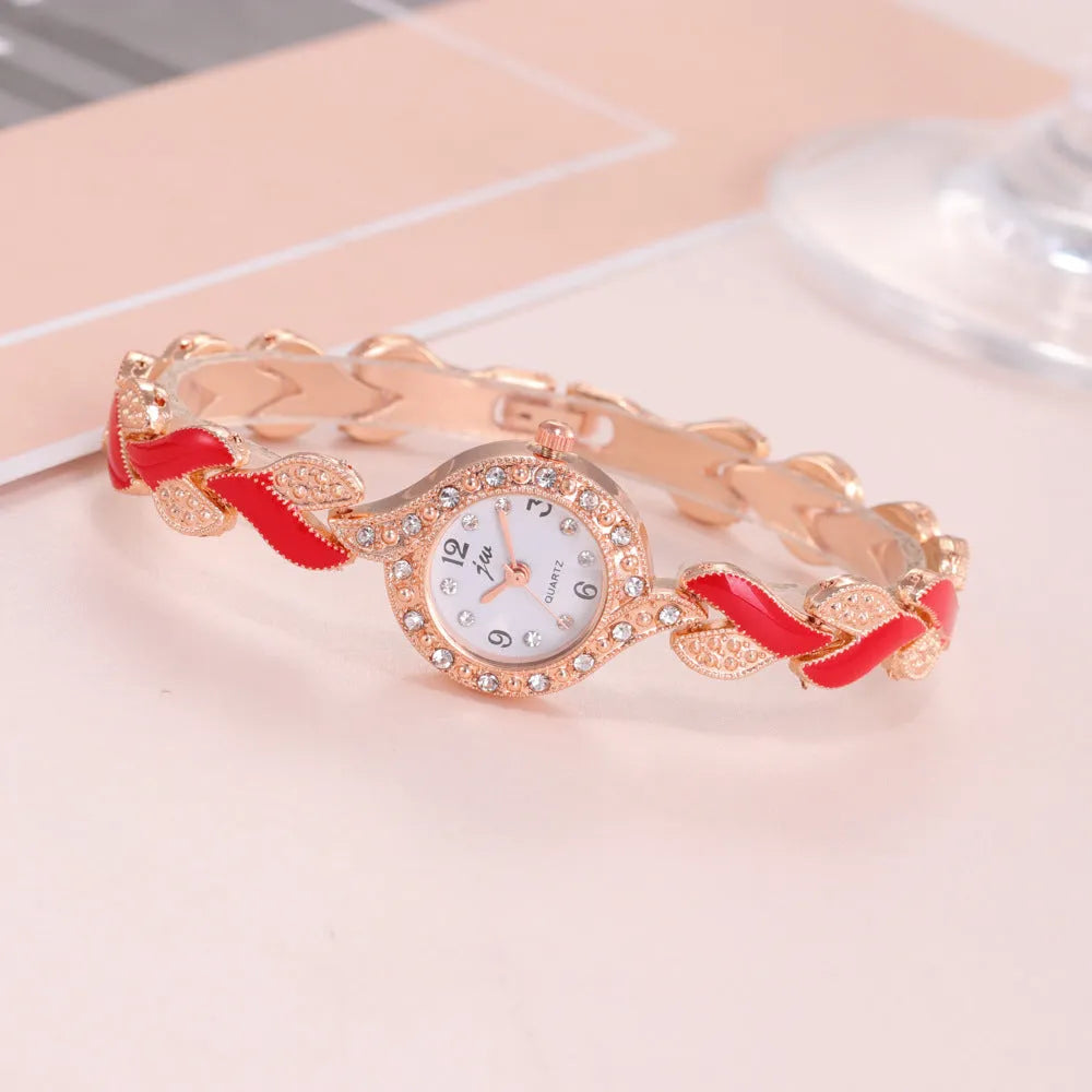 Women's love strap diamond watch with matching earrings, ring, and necklace in black suit option
