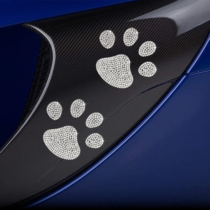 Glass car sticker with diamond-encrusted butterfly and bear paw design, 7cm by 6cm.