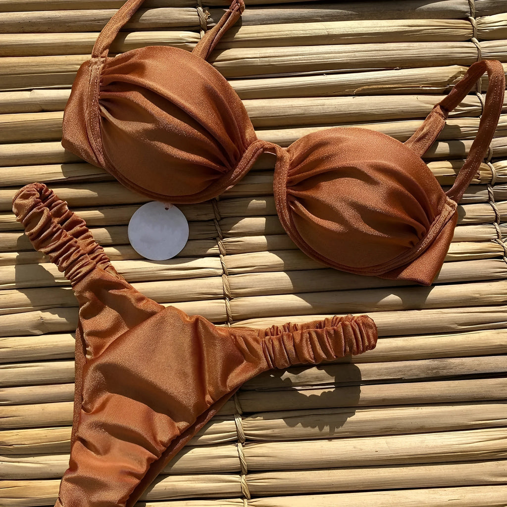 Women's black underwire bikini swimsuit with split high-leg briefs on a mannequin.