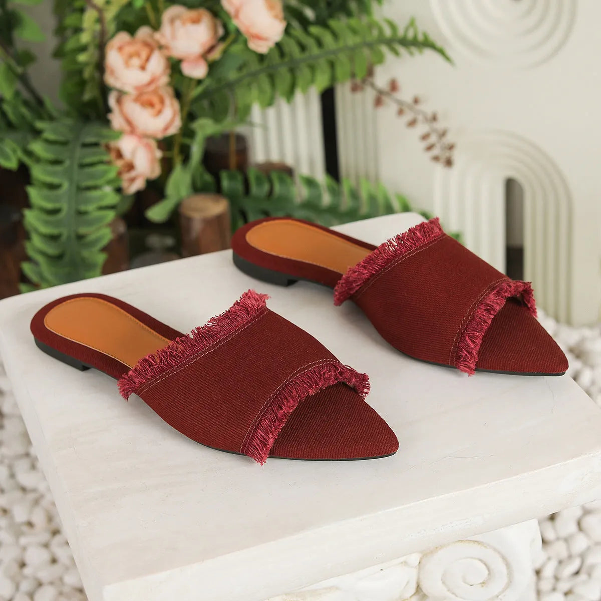 Women's denim flat slippers with tassel detail and leather lining in solid colour