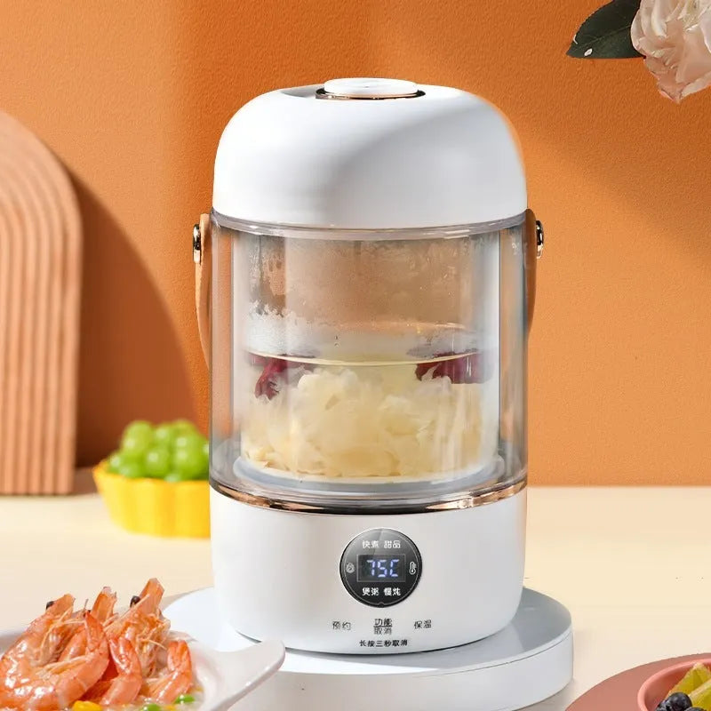Smart portable electric stew cooker with transparent glass lid showing food inside, on a kitchen counter.