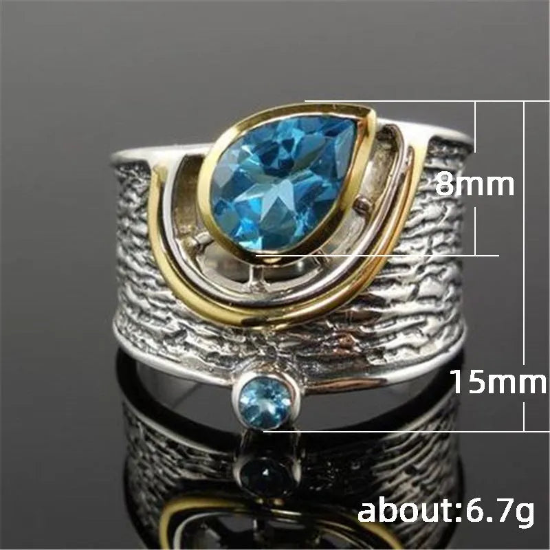 Blue drop-shaped women's ring with inlaid zircon rhinestones on an alloy band.
