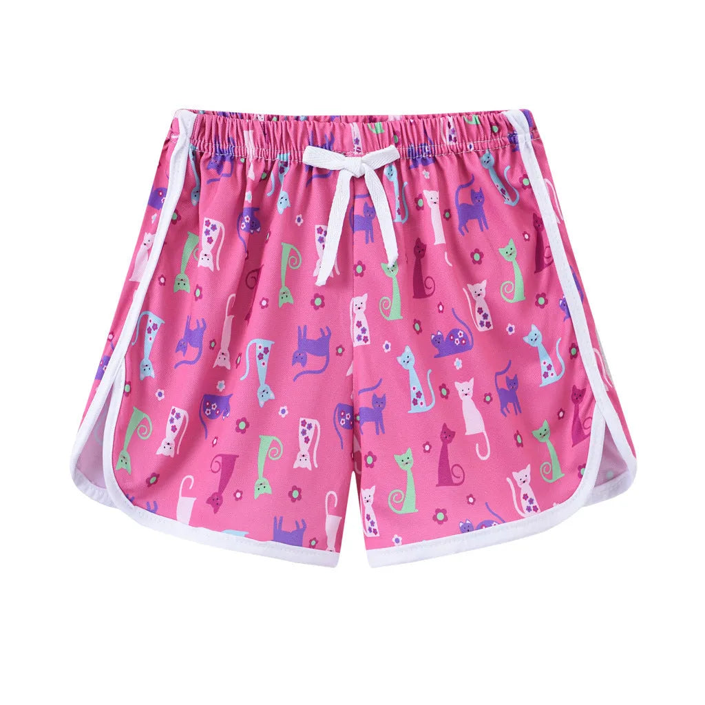 Children's elastic waistband beach shorts in multiple colours and patterns including stripes, florals, and animal prints