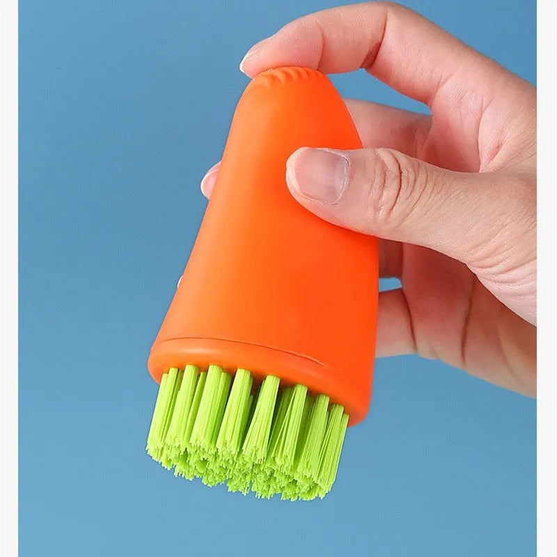 Orange and white radish-shaped nylon carrot cleaning brush for vegetables.