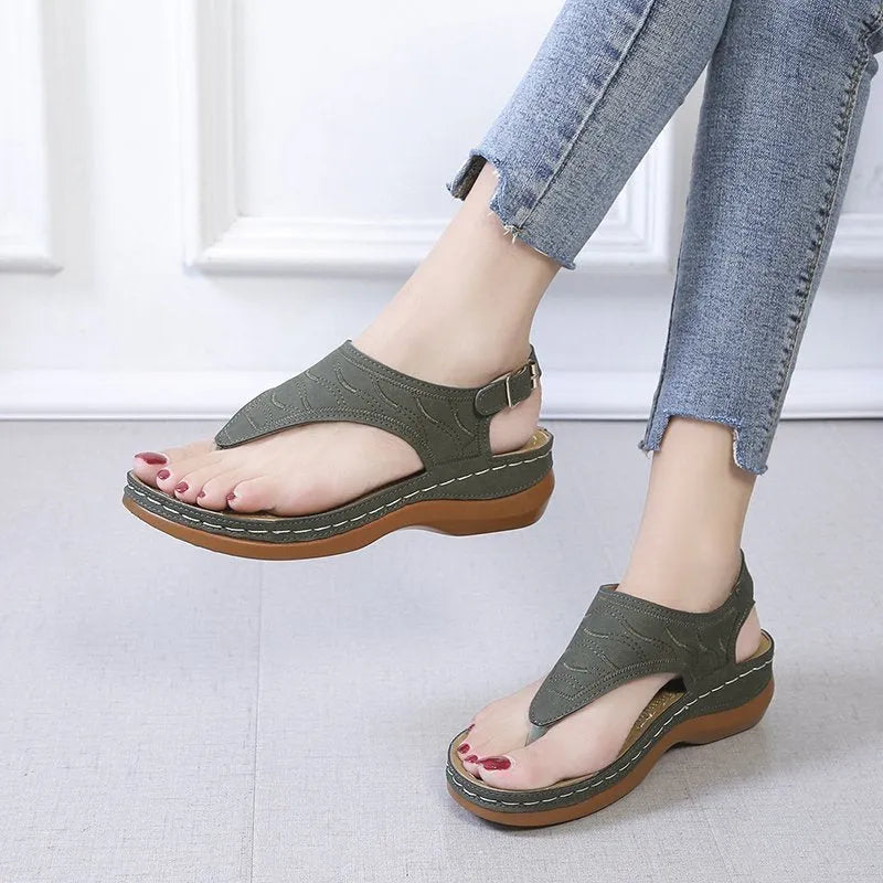 Women's casual wedge heel sandals with adjustable buckle strap in solid red colour