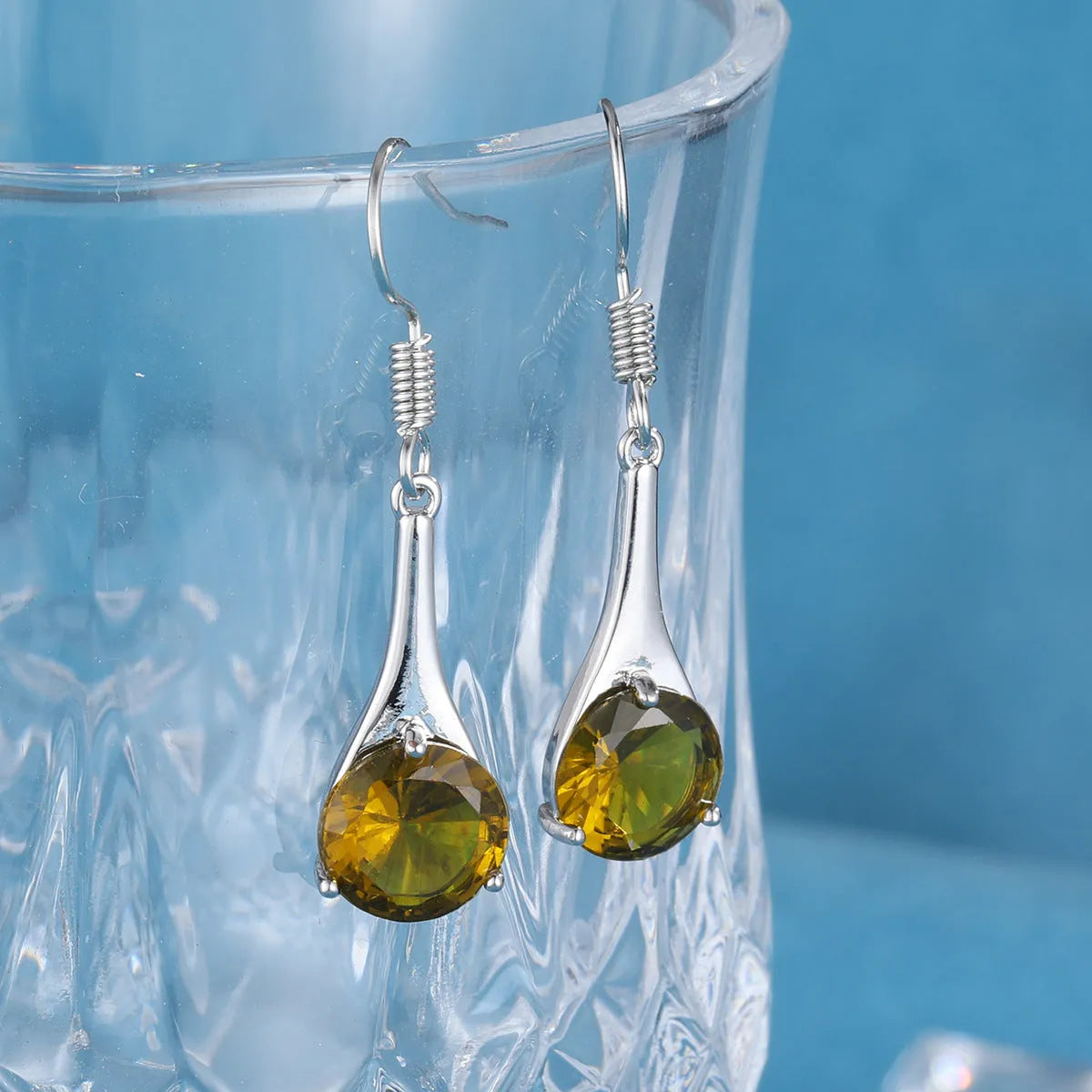Olive green topaz water drop shaped earrings with retro style and electroplated alloy construction