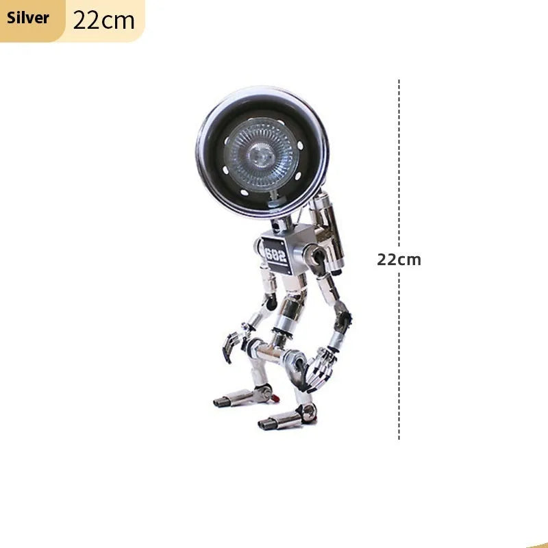 Silver copper robot-shaped table lamp with atmospheric lighting on study desk