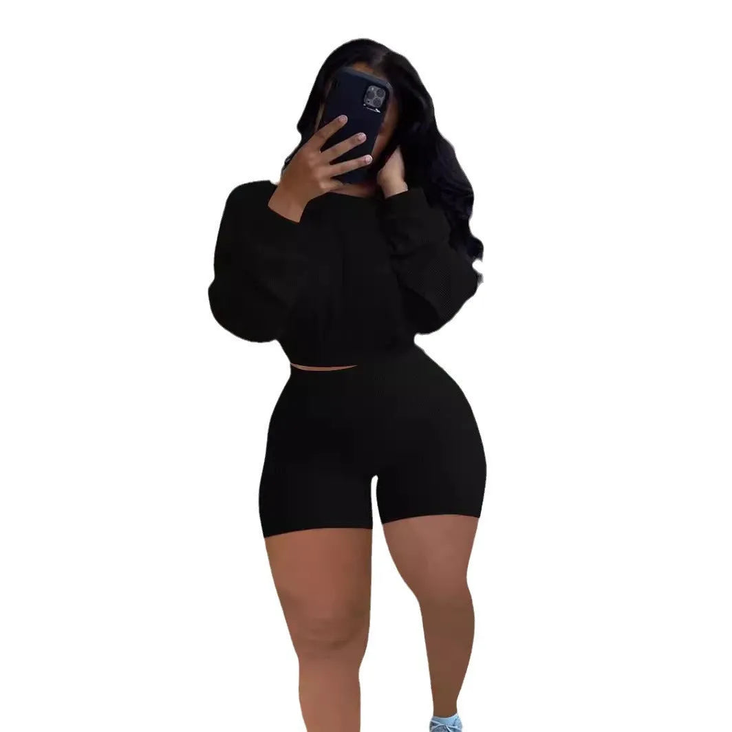 Women's off-the-shoulder long sleeve top and matching shorts two-piece set in a sunken stripe pattern.