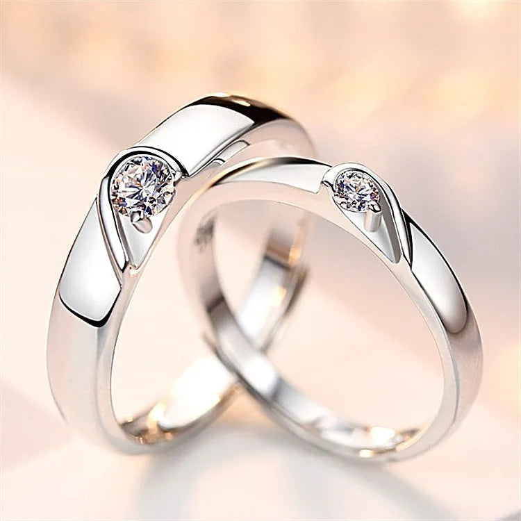 Heart-shaped diamond ring on finger, copper electroplate finish, couples wedding engagement style