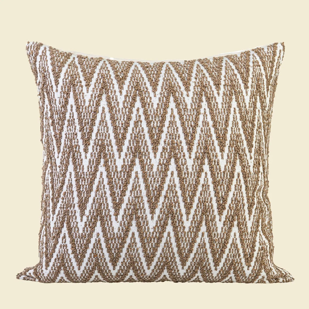 Chinese style square pillow cushion with geometric pattern in Maillard colours on sofa