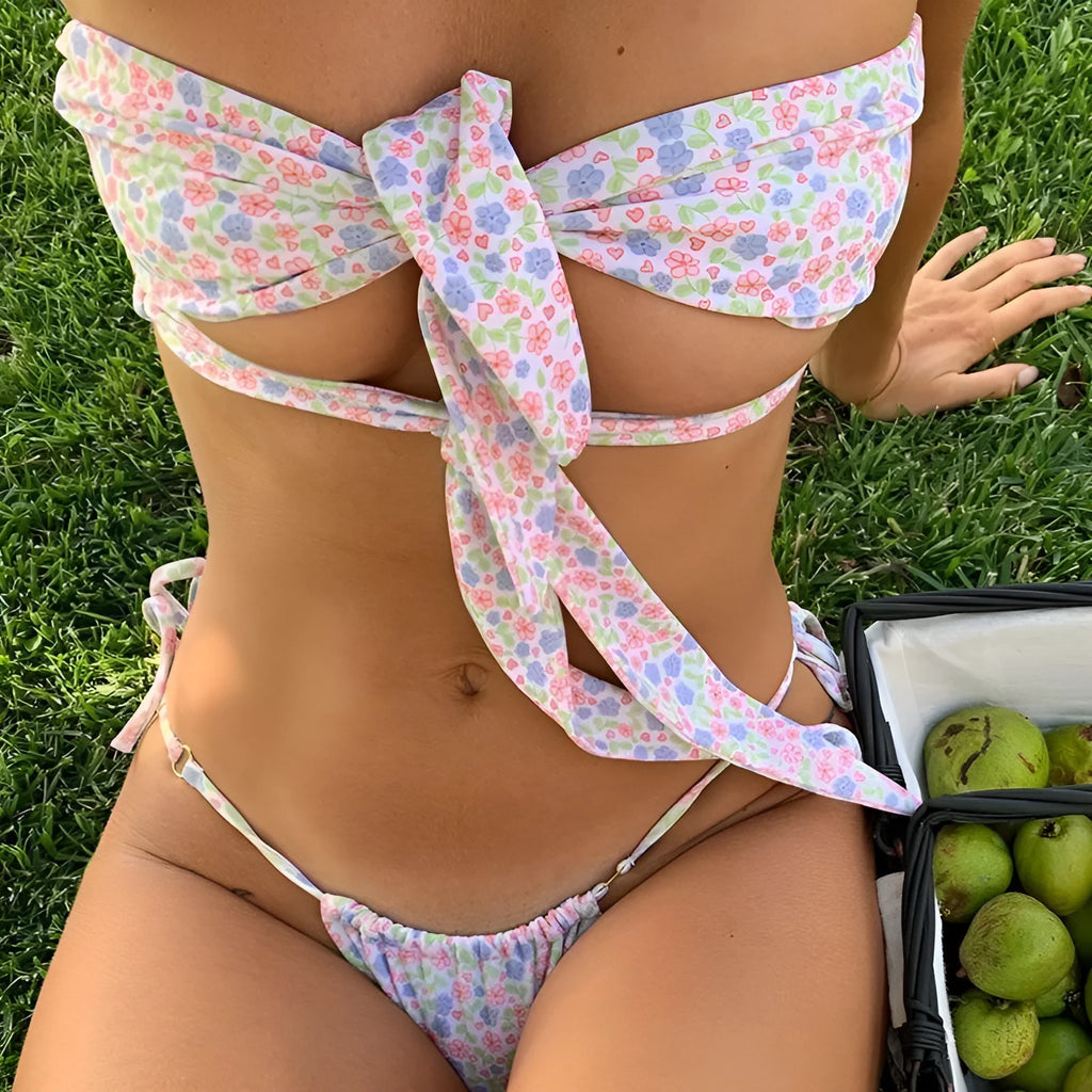 Women's lace-up front swimsuit with split sides and removable chest pads in a floral print colour