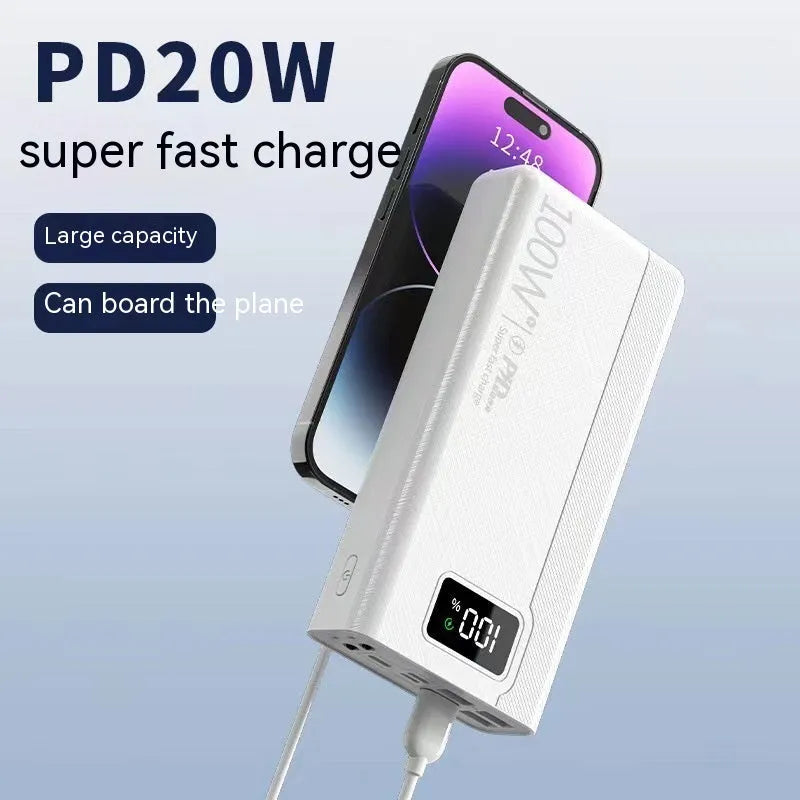 Black and white large capacity power bank with fast charging support, showing size scale.