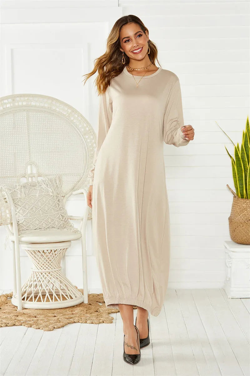 Women's black loose lantern dress with lace-up crew neck detail.