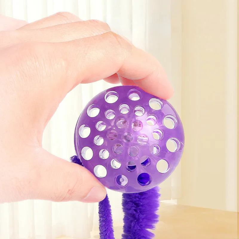 Interactive cat ball toy with flexible plush tail attached to bouncy TPR ball