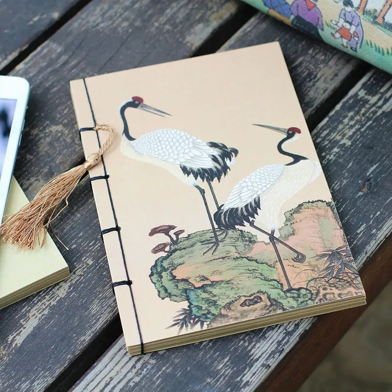 Antique wire-bound notebook with embossed cowhide cover and black wax rope binding