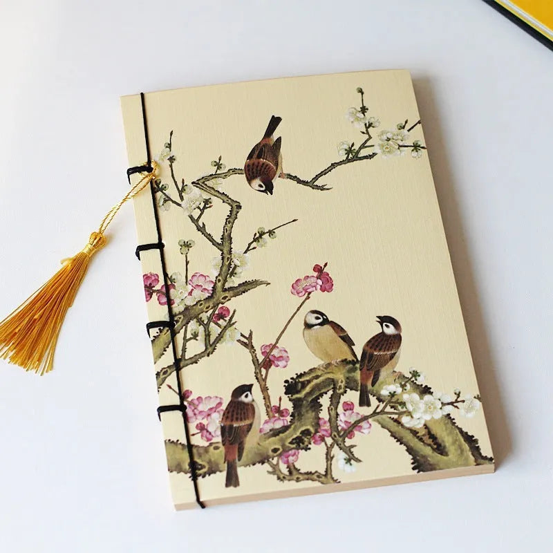 Antique wire-bound notebook with embossed cowhide cover and black wax rope binding