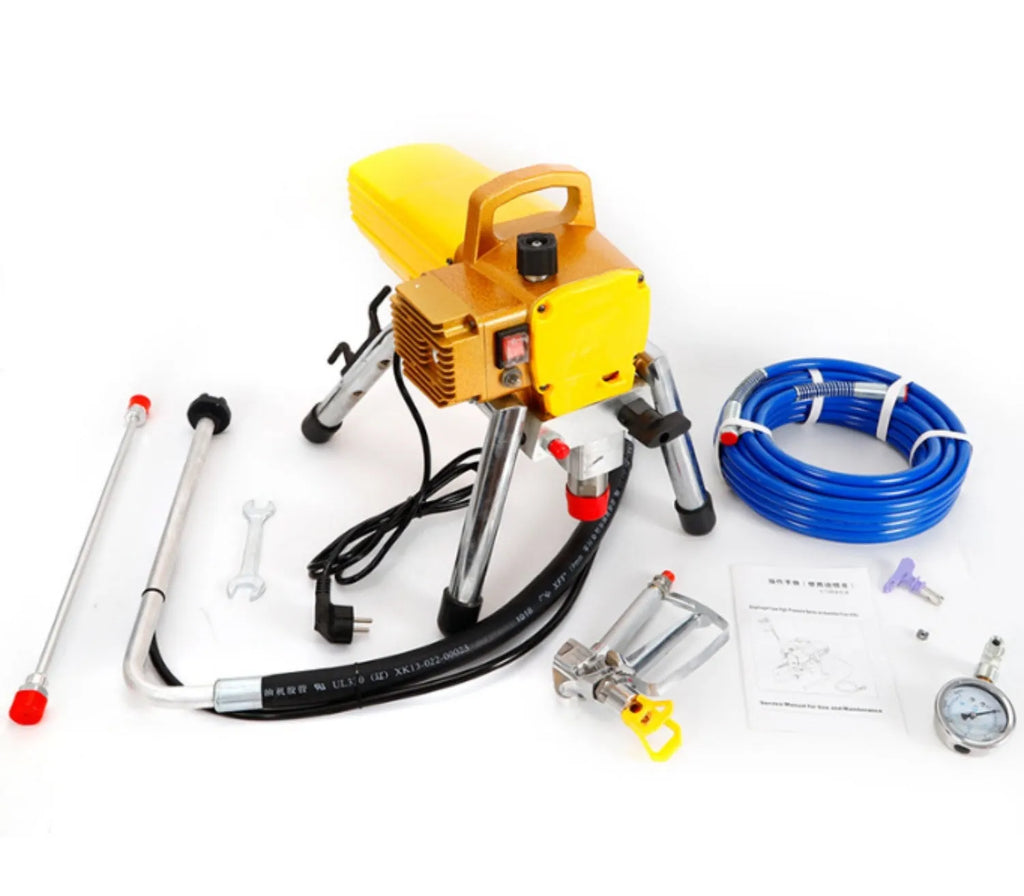 Portable blue electric airless spraying machine with spray gun and accessories on a workbench.