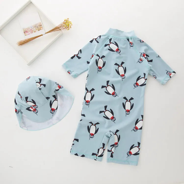 Boy's penguin themed long sleeve swimsuit with matching swimming cap for sun protection