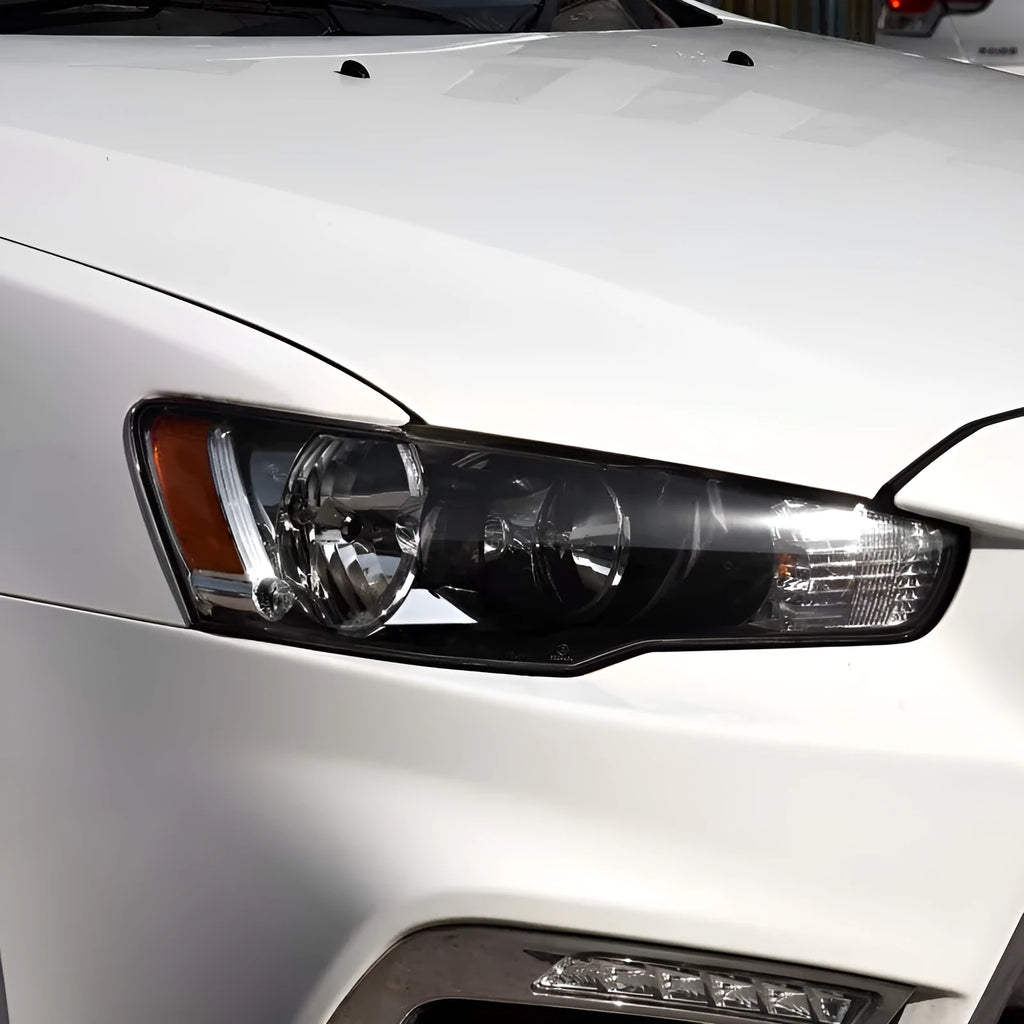 Clear plastic car headlight housing cover with dimensions 50mm by 30mm by 20mm.