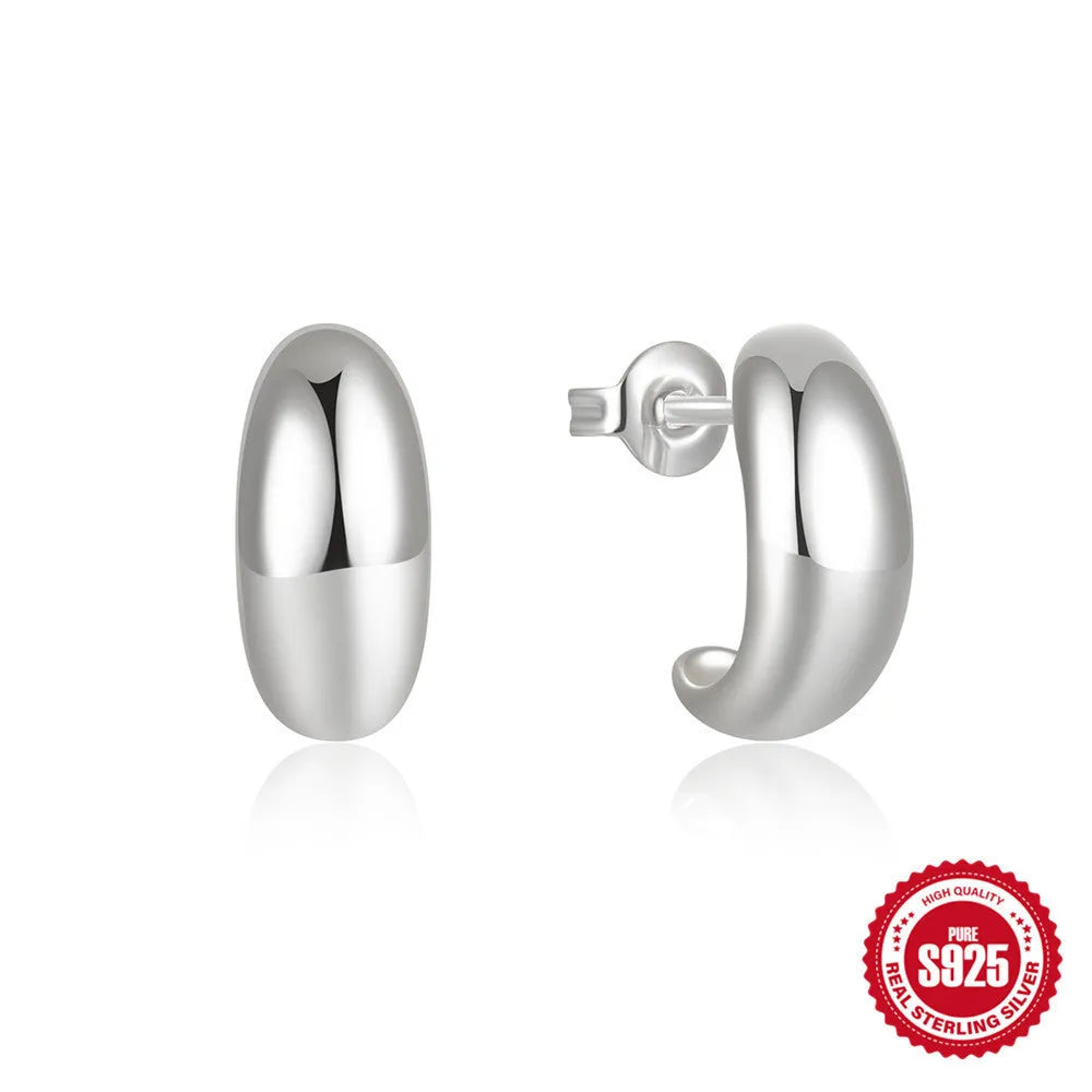 Sterling silver C-shaped stud earrings with glossy electroplated finish in gold or white gold